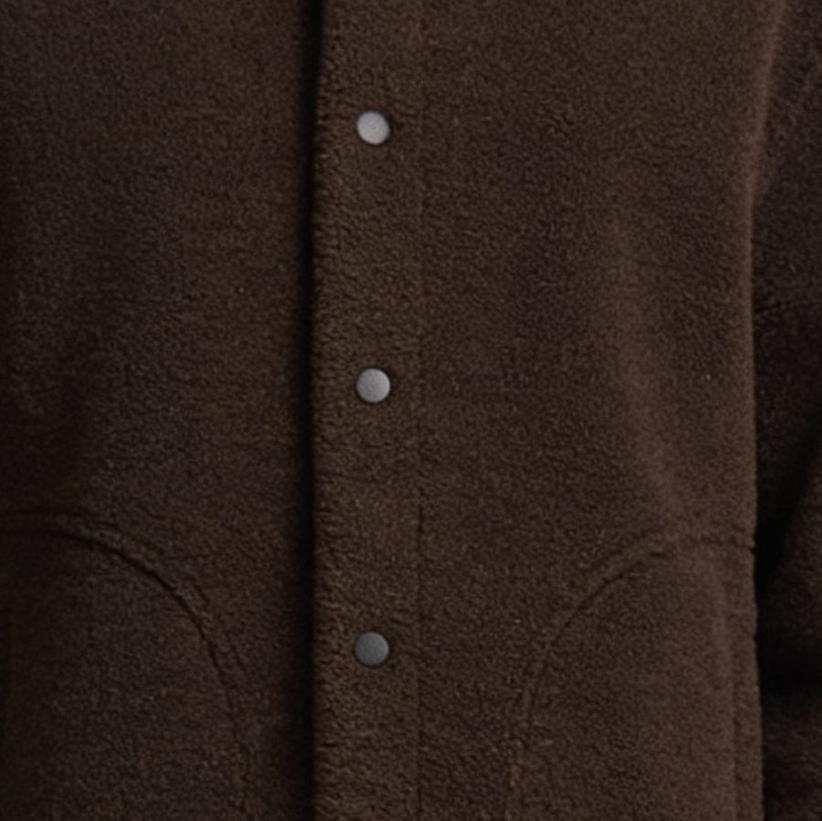 Close-up of brown brushed fabric and buttons