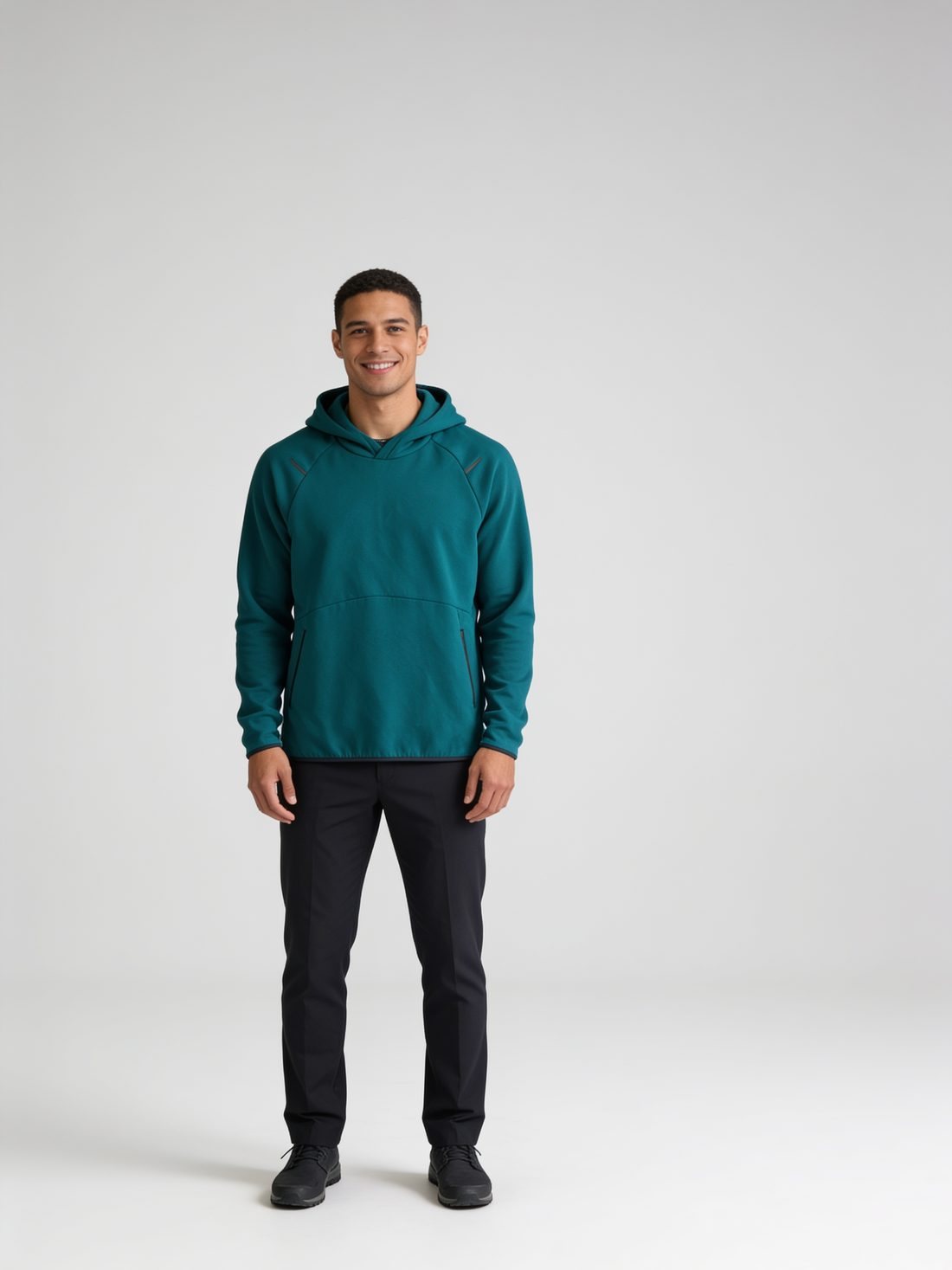 Model in a teal pullover hoodie
