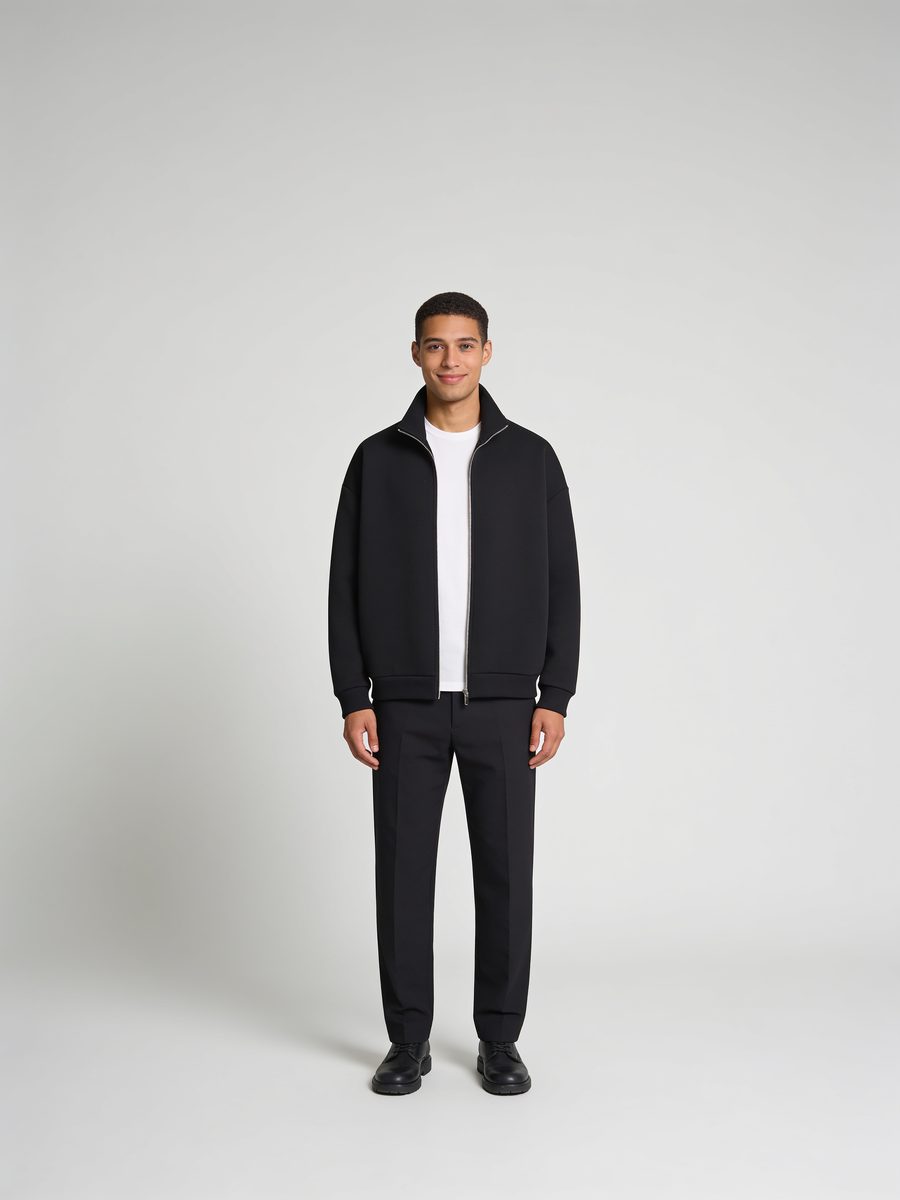 Zip jacket worn open over a white tee
